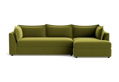 a green sectional sofa with pillows on the top and bottom, in front of a white background