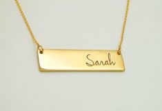 This is a solid 14K gold name necklace bar that comes in two sizes:1.25 in wide and 0.33 in tall  (longer chains are available at the drop down menu)1.5 in wide and 0.4 in tall  (longer chains are available at the drop down menu)To add a diamond + $45 (in the drop down menu)To add a colored gemstone + $15 (in the drop down menu)To add more birthstones https://etsy.me/31k4A1zTo add more diamonds https://etsy.me/318joQFImportant:● This is not laser engraving on the surface, all letters are deeply Classic Gold Rectangular Bar Necklace, Classic Rectangular Gold Bar Necklace, Yellow Gold Rectangular Bar Necklace, Classic Gold Nameplate Bar Necklace, Gold Engraved Nameplate Bar Necklace, Gold Bar Necklace With Rectangular Pendant For Personalized Gift, Gold Nameplate Bar Necklace, Gold Bar Necklace With Nameplate, Gold Rectangular Bar Necklace With Name