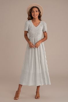 Black Casual Fitted Midi Dress With Smocked Cuffs, Casual Ruched Maxi Dress With Empire Waist, Casual Maxi Dress With Ruched Empire Waist, Casual Ruched Midi Dress With Empire Waist, Casual Ruched Empire Waist Midi Dress, Casual Smocked Empire Waist Dress, Casual Midi Dress With Smocked Bodice Empire Waist, Casual Dress With Smocked Back For Daywear, Maxi Length Smocked Dress For Daywear