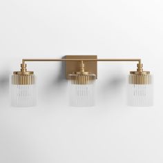 three light brass bathroom fixture with clear glass shades