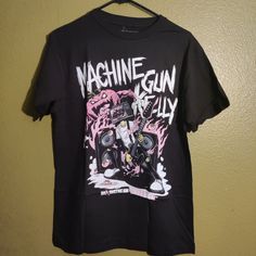 T-Shirt Machine Gun Kelly Grunge Graphic Print Shirt For Fans, Alternative Style Graphic Print Tops For Fans, Edgy Black T-shirt With Screen Print, Edgy Black Shirt With Letter Print, Black Cotton Shirt With Front Print, Punk Style Crew Neck Shirt With Graphic Print, Black Edgy Pre-shrunk T-shirt, Black Edgy Shirt With Graphic Print, Alternative Cotton Shirt For Fan Merchandise