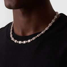 This necklace showcases alternating Baguette and Round Brilliant-Cut Crystal, each framed within a silver 4-claw setting. This design not only protects the stones but also maximises their ability to reflect natural light like never before. Each clear crystal is surrounded by a cluster of the coldest, AAA-grade stones—handpicked and precision-set to deliver a shine that rivals even the finest diamonds. The coupled links rest effortlessly along your neckline, while its snap-proof clasp and scratch Iced Out Crystal Jewelry For Formal Occasions, Timeless Silver Jewelry With Sparkling Stones, Timeless Silver Jewelry For Party, Timeless Silver Necklace For Party, Elegant Iced Out Necklace For Anniversary, Modern Silver Jewelry With Baguette Cut, Classic Silver Jewelry With Rectangular Stone, Luxury Silver Crystal Diamond Necklace, Silver Necklace With Baguette And Diamond Cut