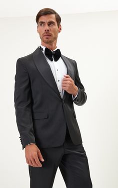 DETAILS If you find your evening event calendar filling up fast, it might be time to boost your black tie attire with a luxurious dinner jacket, like our classic black style. Made from a textured lustrous fabric with tactile irregularities on the surface, it's tailored with elegant shawl lapels and fastens with covered buttons for a streamlined finish. The full lining reinforces the fine cloth and means it'll layer smoothly over your shirt. The suit consists of a tuxedo jacket and a pair of pant Luxury Black Shawl Collar Tuxedo, Black Tailored Tuxedo With Button Closure, Black Satin Bow Tuxedo Ties, Black Tuxedo-style Outerwear In Suiting Fabric, Classic Black Single-button Tuxedo, Black Tie Attire, Elegant Shawl, Dinner Jacket, Tuxedo Jacket