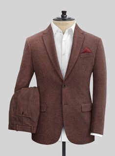 Show up in your finest to every occasion in our Mute Wine Herringbone Tweed Suit. Crafted from wool, this suit is classically styled with a modern appeal to give you a striding confidence everytime you wear it, tweed with its practical, hard wearing qualities, can be dressed up or down, making it a perfect material for a modern man. A white shirt and polished black shoes are all you need to adorn this look. 
 
Look Includes   Mute Wine Herringbone Tweed Fabric  Two Button Jacket Style  Notch Lap Formal Tweed Suit With Suit Collar, Fitted Tweed Suits With Herringbone Pattern, Fitted Tweed Suit With Notch Lapel, Elegant Tailored Tweed Three-piece Suit, Formal Tweed Blazer With Suit Collar, Semi-formal Tweed Suit With Suit Collar, Wool Suits With Herringbone Pattern And Suit Collar, Formal Winter Suit With Herringbone Pattern, Tweed Notch Lapel Suit For Business Casual