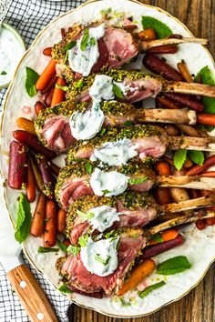 a white plate topped with meat and veggies on top of a wooden table