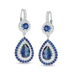 Give her a reason to dress up with these dazzling fashion drop earrings. Crafted in sterling silver, each earring features a dangle centered with a 9.0 x 6.0mm pear-shaped lab-created bright blue sapphire. Frames of lab-created white and blue sapphires wrap the center stone in a sparkling embrace. Above, a round blue sapphire is framed with a halo of white sapphires, while additional white sapphires line the fronts of the lever back closures. Buffed to a brilliant luster, these earrings are the Luxury Blue Pear-shaped Earrings, Blue Diamond Drop Earrings, Elegant Pear-shaped Blue Jewelry, Elegant Blue Pear-shaped Jewelry, Luxury Blue Drop Earrings, Dazzling Blue Earrings With Diamond Accents, Elegant Blue Cubic Zirconia Chandelier Earrings, Blue Diamond Accented Drop Earrings, Elegant Blue Diamond Dangle Earrings