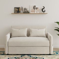 a living room with a couch, rug and shelf on the wall next to it