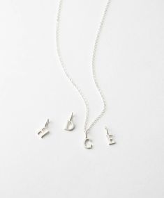 A timeless serif pendant adorned on an elegant chain says it with sophistication. Create a custom look by adding extra letters, disks, or tags with our personalized add-ons. Tan Initial Pendant Necklace, Delicate Everyday Charm Necklaces With Initial Pendant, Dainty Charm Necklaces With Initial Pendant For Everyday, Delicate Everyday Charm Necklace With Initial Pendant, Sterling Silver Initial Pendant Charm Necklace With Delicate Chain, Everyday Sterling Silver Initial Necklace With Delicate Chain, Sterling Silver Initial Pendant Necklace With Delicate Chain, Silver Minimalist Initial Necklace With Delicate Chain, Classic Silver Initial Necklace With Delicate Chain