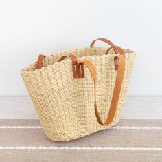 IN STOCK. FAST SHIPPING FROM LOS ANGELES. 3-5 DAYS Chic simple straw woven tote bag perfect for all occasions.Size approximately 16 inches opening wide x9.5 inches tallShort handle 8.5 inches.Long handle 15 inches Designer Style ID: 8580 Beige Rectangular Beach Bag With Braided Handles, Rectangular Jute Beach Bag With Braided Handles, Woven Straw Bag With Double Handles, Straw Beach Bag With Rolled Handles, Straw Beach Bag With Rolled Double Handles, Summer Basket Bag With Rolled Handles, Daily Use Straw Bucket Bag With Braided Handles, Daily Use Straw Bag With Braided Handles, Vacation Straw Bag With Double Rolled Handles