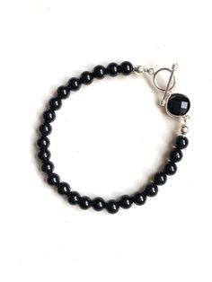 Black onyx Sterling silver Modern Black Round Bead Bracelets, Everyday Silver Onyx Jewelry, Classic Black Jewelry For Everyday, Silver Crystal Bracelet With Black Beads, Classic Onyx Beaded Bracelets With Adjustable Fit, Classic Black Onyx Jewelry, Elegant Nickel-free Crystal Bracelet With Round Beads, Classic Black Beaded Bracelets As Gift, Everyday Silver Jewelry With Black Beads