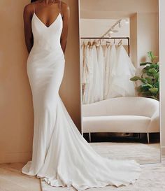 a woman standing in front of a mirror wearing a white wedding dress with spaghetti straps