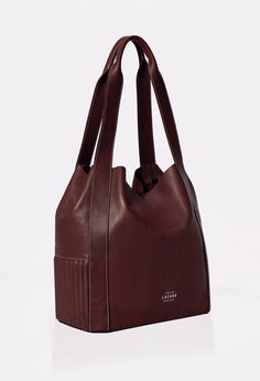 A timeless classic reimagined in a modern design. Thoughtfully crafted to be your perfect companion for day-to-day life. Its generous size makes it ideal for carrying your essentials while adding a touch of style to your everyday adventures. Modern Bucket Bags For On-the-go, Luxury Brown Hobo Bag For Everyday, Classic Satchel Shoulder Bag For Everyday, Timeless Everyday Satchel Shoulder Bag, Classic Brown Bucket Bag For On-the-go, Modern Square Hobo Bag For Everyday Use, Classic Bucket Shoulder Bag For On-the-go, Classic Rectangular Hobo Bag With Removable Pouch, Casual Everyday Burgundy Shoulder Bag