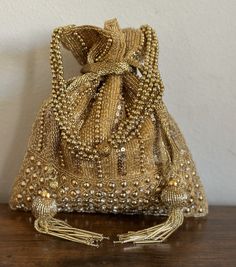 Indian Potli Bag for Women Beaded Drawstring Purse for - Etsy Handmade Gold Potli Bag For Party, Handheld Evening Bag For Festivals, Festival Party Gift Bag Pouch, Festive Party Gift Bag Pouch, Gold Rectangular Potli Bag For Festive Season, Gold Shoulder Bag With Handwork For Festivals, Festive Gold Rectangular Potli Bag, Gold Rectangular Clutch For Diwali, Bollywood Style Gold Festive Shoulder Bag