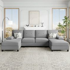 a large gray sectional couch in a living room