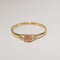 "Thanks for shopping our vintage estate store. We tend to sell well below wholesale and truly hope you enjoy all of our items. Many of the items are one of a kind, so please enjoy scrolling through the pictures and hopefully something will catch your eye. Brown spots are from the camera or reflections. Estate 10k yellow rose gold leaf rose ring. Looks like a Black Hills Gold ring, but not marked as such.  Has yellow rose gold leaves on each side. Ring size: 7 Setting: 1/4\" 4mm Band width: 1.5mm Vintage 14k Gold Flower Promise Ring, Vintage Gold Flower Promise Ring, Vintage Style Gold Flower Promise Ring, Gold Vintage Style Flower Promise Ring, Vintage 14k Gold Flower Ring, Vintage 14k Gold Flower Ring For Anniversary, Vintage 14k Gold Flower Ring For Gift, Vintage Yellow Gold Flower Ring, Vintage 14k Rose Gold Flower Ring