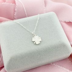 A simple and elegant sterling-silver Four Leaf Clover, a perfect lucky charm to wear during the day. The Clover Pendant is dainty, very lightweight and would be perfect for layering or as a stand-alone necklace. * D E T A I L S * * 10mm charm * Sterling Silver * Dainty Style * 3 chain lengths available (16, 18, and 20 inch) L I K E ∙ W H A T ∙ Y O U ∙ S E E ? More Clover Jewelry * https://etsy.me/2v16Q1K More Necklaces * https://etsy.me/2PEnETk More from our shop * https://etsy.me/2vasKjo Are yo Lucky Four Leaf Clover, Silver Initial Charms, Lucky Charm Necklace, Clover Jewelry, Dainty Style, Pretty Jewelry Necklaces, Celtic Pendant, Four Leaf Clover Necklace, Signature Necklace