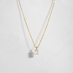 Timeless Rectangular Pendant Jewelry, Gold Radiant Cut Cubic Zirconia Necklaces, Gold Radiant Cut Cubic Zirconia Necklace, Gold Cubic Zirconia Necklace With Radiant Cut, Dainty Emerald Cut Baguette Diamond Jewelry, Dainty Jewelry With Baguette Emerald Cut Diamonds, Elegant Emerald Cut Baguette Diamond Necklaces, Gold Radiant Cut Necklace Fine Jewelry, Emerald Cut Gold Solitaire Necklace