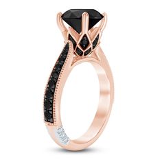 a rose gold engagement ring with black diamonds