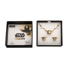 the star wars necklace and earrings set is in a black box with gold trimmings