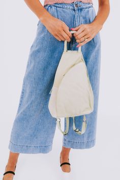 Carry all your essentials in style with the FREE PEOPLE - Soho Convertible Bag. This leather tote bag is the perfect versatile accessory for any outfit, giving you both practicality and fashion in one. Stay organized and effortlessly chic with this must-have bag. Spring Travel Khaki Shoulder Bag, Casual Leather Backpack For On-the-go, Versatile Everyday Hobo Bag With Zipper Pocket, Spring Travel Backpack Shoulder Bag, Khaki Backpack For Everyday Use, Versatile Canvas Hobo Bag For On-the-go, Versatile Hobo Bag With Zipper Pocket For On-the-go, Versatile Khaki Bag With Zipper Pocket, Versatile Khaki Backpack