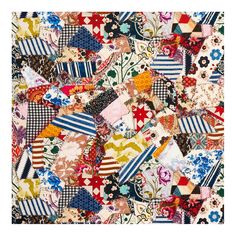 many different colored pieces of fabric with flowers and stripes on the top, all together