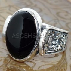 NATURAL BLACK ONYX GEM WEDDING BAND RING PERFECT PROMISE GIFT FOR HIM MATERIAL-925 Sterling Silver GEMSTONE- Black Onyx GEMSTONE COLOR- Black GEMSTONE SHAPE- Oval Shape GENDER- Male,Female BIRTHSTONE- December JEWELRY TYPE- Ring HEALING PROPERTIES OF GEMSTONE- A powerful protection stone, Black Onyx absorbs and transforms negative energy, and helps to prevent the drain of personal energy. Black Onyx aids the development of emotional and physical strength and stamina, especially when support is n Ornate Black Sterling Silver Rings, Ornate Black Rings For Gifts, Ornate Black Rings As Gift, Ornate Black Rings For Gift, Classic Carved Signet Ring For Wedding, Victorian Carved Ring For Anniversary, Black Oval Ring For Wedding, Traditional Black Sterling Silver Rings, Traditional Oval Signet Ring For Wedding