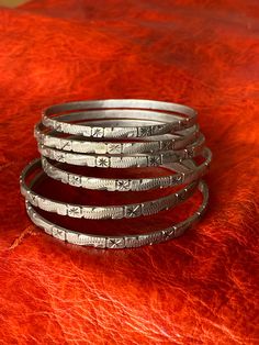 "*ONE* Bangle Bracelet This is a vintage, solid silver piece from Southern Morocco. This bracelet has an inner diameter 2 3/8\" (5,4 cm) and measures 3.75 mm wide. The bracelets feature stamped and filed designs. It is a single bracelet that comes from a traditional set of seven."