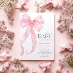 a baby shower with pink bows and flowers