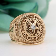 Men's University of Texas 1991 10K Yellow Gold 0.10 TW Diamond Ring Size 9.25 Estate Metal: 10K Yellow Gold  Hallmark:  10K, BALFOUR, 1991, BA Ring Measurements: 21.45 mm in Width & 7.40 mm in Height (tapering down to 7.90 mm at the bottom of the ring's shank) Ring Size: 9.25 (Resizable)* *For resizing, please purchase the respective resizing fee amount, along with your ring. Weight: 27.6 gr total gram weight Center Diamond: One Natural, Round Brilliant Cut Diamond, Weighing 0.10 TW Center Diamo University Of Texas, Round Brilliant Cut Diamond, Rings Statement, Statement Rings, Diamond Ring, Jewelry Watches, Jewelry Rings, Ring Size, Fine Jewelry