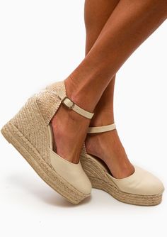 Castañer fuses laid-back cool with summertime glamour to create this pair of classic ivory Carol wedge espadrilles. The effortless warm-weather silhouette is set on a jute wedge with a rubber outsole and comes complete with elegant ankle ties. Let yours ground floating printed dresses on your next vacation. Cotton Canvas 4" Heel Height EU Sizing (size 37 corresponds to size 7) Made in Spain Runs true to size, we recommend taking your usual size. Wedge Espadrilles, Printed Dresses, Online Purchase, Warm Weather, Beauty Women, Cotton Canvas, Print Dress, Espadrilles, Floating