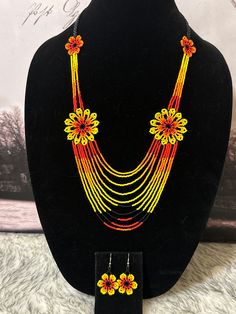 Beautiful set of necklace and earrings handmade by Mexican artisans. Yellow Multi-strand Jewelry As A Gift, Yellow Multi-strand Jewelry Gift, Yellow Multi-strand Necklace For Gift, Multicolor Pendant Jewelry Sets, Traditional Orange Multi-strand Jewelry, Yellow Dangle Necklaces As Gifts, Multicolor Multi-strand Jewelry For Gifts, Dangling Beads Jewelry Set As A Gift, Multicolor Multi-strand Jewelry Gift