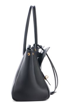 A new icon entered the Balenciaga pantheon of bag styles on the fall '24 runway—the Bel Air crafted from smooth calfskin leather and shaped for shifting with snap side gussets and an almost Escheresque front panel of exterior pockets. Open top Shoulder straps Exterior pockets Structured silhouette with flat base and protective metal feet Leather Made in Italy Designer Handbags Black Calf Leather Satchel With Gold-tone Hardware, Black Calf Leather Shoulder Bag With Gold-tone Hardware, Black Calf Leather Shoulder Bag With Detachable Strap, Luxury Structured Shoulder Bag In Calf Leather, Luxury Structured Calf Leather Shoulder Bag, Luxury Travel Bucket Bag With Gold-tone Hardware, Timeless Black Saffiano Leather Bag, Black Calf Leather Shoulder Bag For Travel, Modern Bucket Bag With Gold-tone Hardware For Travel