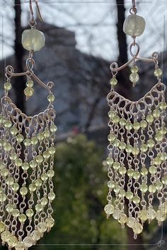 Adorn your ears with the soothing symphony of nature embodied in our Peridot Wind Chime Eardrops. Crafted with delicate wirewrap and vibrant peridot gemstones, these earrings evoke the gentle melodies of wind chimes, bringing harmony and elegance to your every movement.#longdropearring#wirewrap#wirejewelry#handmadejewelry#DIYearring#bohoearring#Beachstyle#Peridotjewelry#wire work Green Beaded Bohemian Chandelier Earrings, Green Bohemian Chandelier Earrings With Dangling Beads, Bohemian Hand Wrapped Dangle Earrings, Bohemian Hand-wrapped Dangle Earrings, Bohemian Green Beaded Chandelier Earrings, Bohemian Wrap Earrings With Ear Wire, Nickel Free Green Bohemian Chandelier Earrings, Green Bohemian Chandelier Earrings Nickel Free, Green Nickel-free Bohemian Chandelier Earrings