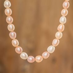 Luminous cultured pearls in assorted shades of pink, peach and cream make up a classic strand necklace. Costa Rican artisan Miriam Bruten creates the necklace, adding a sterling silver toggle clasp to complete the design. Elegant Coral Pearl Necklace With Round Beads, Classic Pink Pearl Chain Jewelry, Formal Pink High Luster Necklace, Pink Pearl Single Strand Jewelry, Pink Single Strand Pearl Jewelry, Pink Pearl Charm Necklace For Formal Occasions, Pink Pearl Drop Necklace For Formal Occasions, Pink Pearl Necklace With Round Beads And Pendant, Formal Pink Pearl Necklace With Pearl Charm