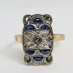 Estate wonderful art deco 18k yellow gold with platinum top sapphire diamond ring. sz 8.25. 3 grams. 16.49mm long. unmarked acid tests for 18k.great condition. estate 1920's ring. will come in great ring box. beautiufl estate piece. 3 small diamond and 6 sapphires. Heirloom Yellow Gold Multi-stone Diamond Ring, Antique Multi-stone Gold Diamond Ring, Antique Yellow Gold Sapphire Ring For Anniversary, Collectible Yellow Gold Jewelry With Rose Cut Diamonds, Luxury Yellow Gold Filigree Ring With Gemstone, Yellow Gold Multi-stone Art Deco Jewelry, Art Deco Multi-stone Yellow Gold Jewelry, Antique Gold Multi-stone Ring, Art Deco Yellow Gold Multi-stone Jewelry