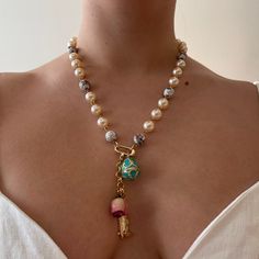 Deadstock cloisonné and faux pearl gold-plated chain with gold-plated charm holder. Charms not included. Use our clip-anywhere charms or anything you desire to make it your own one-of-a-kind piece. Necklace length is 20 inches, up to 23 with extender (included). Shown on shortest setting on neck. Vintage Jewelry Aesthetic, Bday Aesthetic, Pearl Necklace Outfit, Charm Holder Necklace, Mixed Beads Necklace, Vintage Pearl Necklace, Vintage Jewelry Diy, Pearl Charm Necklace, Necklace Outfit