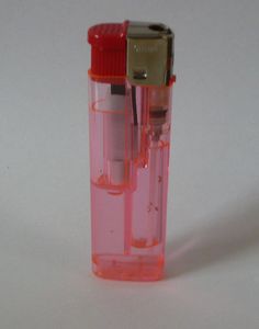 an orange and red lighter on a white surface