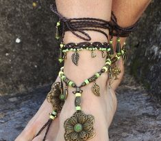 This listing is for one anklet. Beautiful macrame anklet. You can wear it alone or in combination with the barefoot sandals available in my shop (picture 2 and 4) https://www.etsy.com/listing/589470076/big-brass-flower-barefoot-sandals-green?ref=shop_home_active_2 This anklet is made with waxed polyester cord, antique bronze beads and charms and toho seed beads. They close with a lobster claw and on the other side a small chain allows to adjust the length of the anklet. The anklet comes in a bea