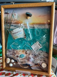 Redemption rum broken bottle art with beach theme Broken Bottle, Chapel Hill Nc, Broken Glass, Upcycle Projects, Chapel Hill, Beach Theme, Bottle Art, Diy Canvas, Beach Themes