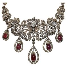 In very good condition. Total weight is 102.4 grams. Totally is diamond about 20 ct. Totally is ruby 28 ct. Total lenght is chain 32 cm. Acid tested to be 8k real gold. Please contact for any questions. Luxury Traditional Rose Cut Diamond Necklace, Victorian Jeweled Necklaces For Formal Occasions, Victorian Ruby Necklace For Formal Occasions, Antique Jeweled Necklace For Wedding, Ornate Jeweled Necklaces For Formal Occasions, Antique Jeweled Necklaces For Wedding, Antique Ruby Necklace For Formal Occasions, Vintage Ruby Necklace For Formal Occasions, Red Victorian Necklace For Anniversary