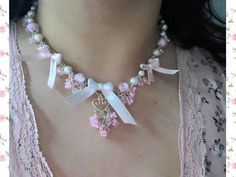 A cute coquette inspired necklace made with silver plated findings, an arrange of different pink and white beads (faux pearls, glass beads, seed beads and hand tied ribbon bows). The necklace max length is a little short of 22 inches with the extender length included. The extender is slightly short of 4 inches.  Limited design while supplies last! Pink Bow Necklace For Party, Cute Pink Pearl Necklace, Cute White Jewelry With Ribbon, White Jewelry With Pink Bow For Party, White Party Jewelry With Pink Bow, Party Jewelry With Pink Bow In White, Adjustable Pink Ribbon Necklace, Cute Pink Pearl Jewelry, Handmade Silver Beaded Necklaces With Cute Style