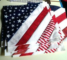 several american flags laid out on a table