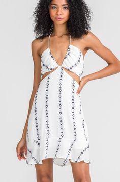 White Embroidered Sundress White V-neck Halter Dress For Vacation, White Sleeveless Mini Dress For Summer Outings, Chic White Mini Dress For Summer Outings, White Tie Back Mini Dress For Vacation, White Mini Dress With Tie Back For Vacation, White Cutout Mini Dress For Beach, Vacation Sundress With Cutout Details, White Backless Mini Dress For Vacation, Vacation Mini Sundress With Cutout