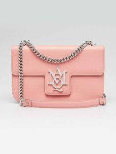 Alexander McQueen Pink Grained Leather Insignia Shoulder Bag Description Alexander McQueen's 'Insignia' bag is made from textured-leather with the new polished silvertone metal logo plaque on the flat front. A chain shoulder strap completes this effortlessly chic look. Just big enough to hold your essentials while still maintaining a feminine touch. Condition The exterior leather is clean and beautiful throughout with some creasing to the body of the bag and shoulder pad. The hardware is bright Alexander Mcqueens, Metal Logo, Leather Handles, Metallic Logo, Pink Leather, Leather Handle, Shoulder Pads, Chain Link, Alexander Mcqueen