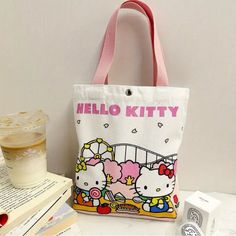 Adorable Hello Kitty Commuter Canvas Bag Authorized Sanrio Cartoon Design,Bag Durable, Water-Resistant, Perfect For School, Work & Travel Officially Licensed Product Good Quality! Fun Design! Trendy Bags With Cartoon Print For Daily Use, Trendy Cartoon Print Bags For Daily Use, Casual Pink Bag With Cartoon Print, Pink Cartoon Print Travel Bag, Trendy White Bag With Cartoon Print, Cute Multicolor Cartoon Print Bags, Rectangular Bags With Cartoon Print For Daily Use, Multicolor Cartoon Style Bag For Everyday Use, Cute Bags With Cartoon Print For Everyday Use