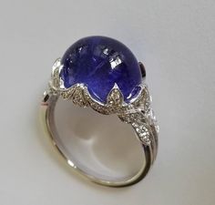 Dalben Tanzanite Diamond Gold Ring | From a unique collection of vintage cocktail rings at https://www.1stdibs.com/jewelry/rings/cocktail-rings/ Exquisite Formal Gemstone Cabochons, Luxury Diamond Cabochons For Wedding, Formal Hallmarked Diamond Cabochons, Elegant White Gold Cabochons For Formal Occasions, Luxury White Gold Diamond Cabochons, Formal Round Gemstone Cabochons, Formal Oval Cabochon Sapphire Ring, Formal Fine Jewelry Ring With Cabochon, Formal Fine Jewelry Gemstone Cabochons