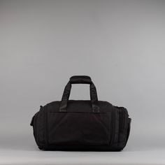 Introducing the pinnacle of travel companions: The Ultimate 30L Duffle Bag made with 1000D Oxford Waterproof Material and YKK Zippers and Clamps. This exceptional bag is meticulously designed to cater to all your needs, from jet-setting adventures to gym sessions and beyond. If anyone can make a duffle bag better, its WOLFpak! Unmatched Versatility: With a spacious 30-liter capacity, this duffle bag offers ample space for all your essentials, ensuring you're prepared for any journey. Its adaptab Multifunctional Black Duffle Bag For Trip, Black Multifunctional Duffle Bag For Trips, Sporty Black Bag For Trip, Multifunctional Black Duffle Bag For Overnight Trips, Functional Waterproof Nylon Weekender Bag, Functional Waterproof Weekender Bag For Travel, Practical Nylon Weekender Bag, Sporty Black Travel Bag For Trips, Black Bags With Functional Pockets For Trip