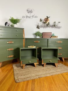 three green dressers and two end tables in a room