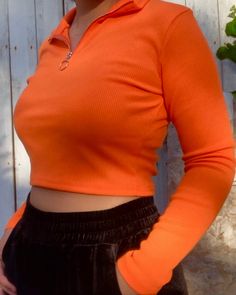 bright orange ribbed long sleeve, quarter-zip up 95% polyester, 5% spandex model is wearing a medium measurements: bust 35", waist 29", hip 39" Orange Crop Top Outfit, Orange Outfits Aesthetic, Bright Orange Outfit, Long Sleeve Under Short Sleeve, Half Zip Outfit, Orange Top Outfit, Orange Shirt Outfit, Leo Rising, Orange Crop Top