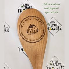 a wooden spoon with a logo on it